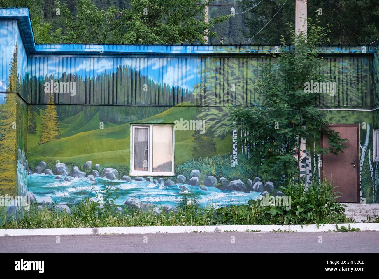 Kazakhstan. Mural of Mountain Scene Painted on Side of House. Stock Photo