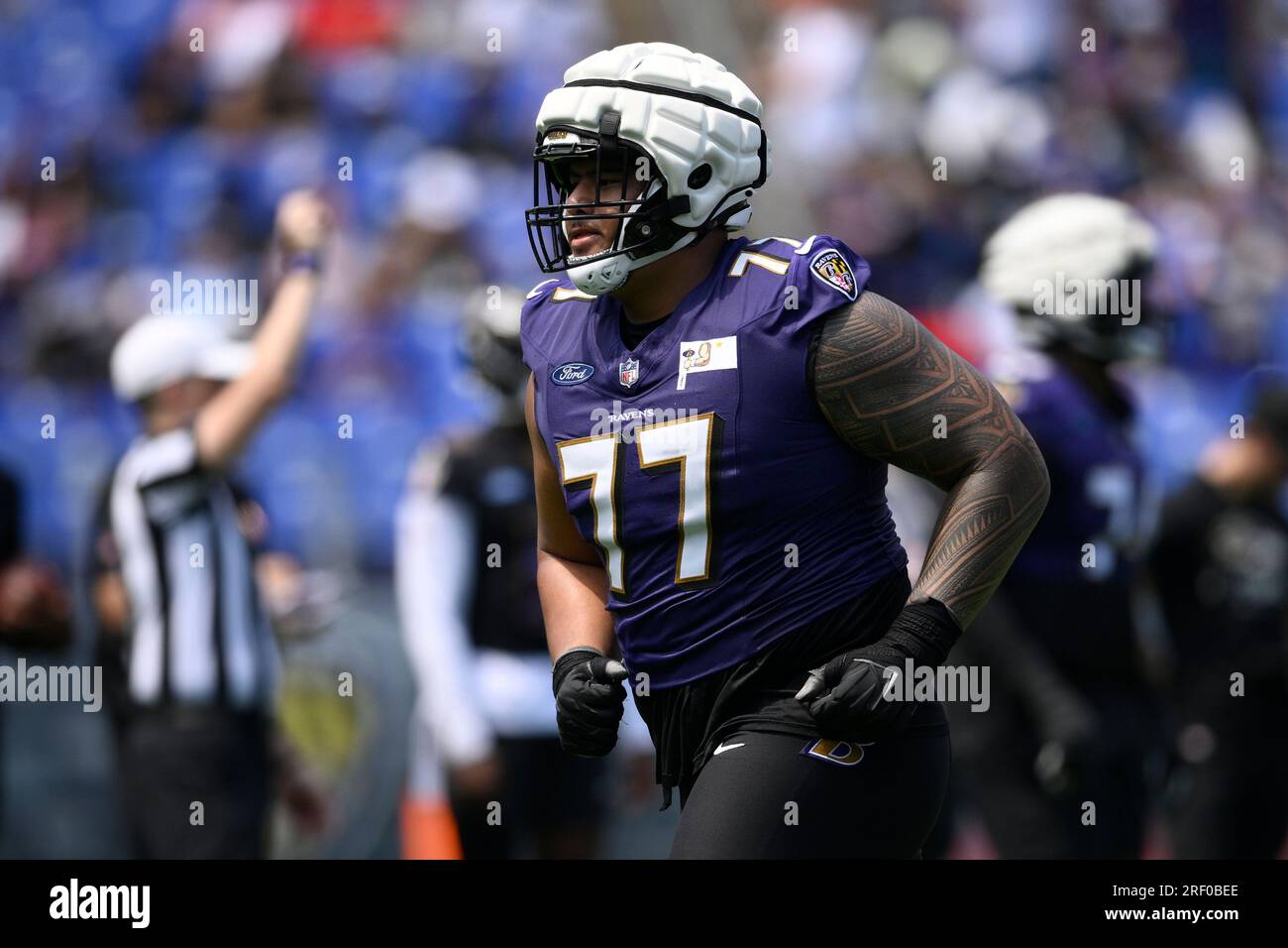 Baltimore Ravens offensive tackle Daniel Faalele plays against the