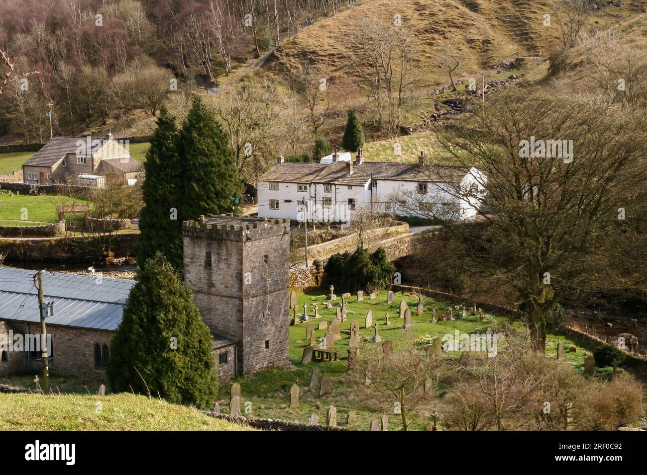 Looking down onto St Michael and All Angels Church and the George Inn in Hubberholme in Langstrothdale, North Yorkshire. Stock Photo