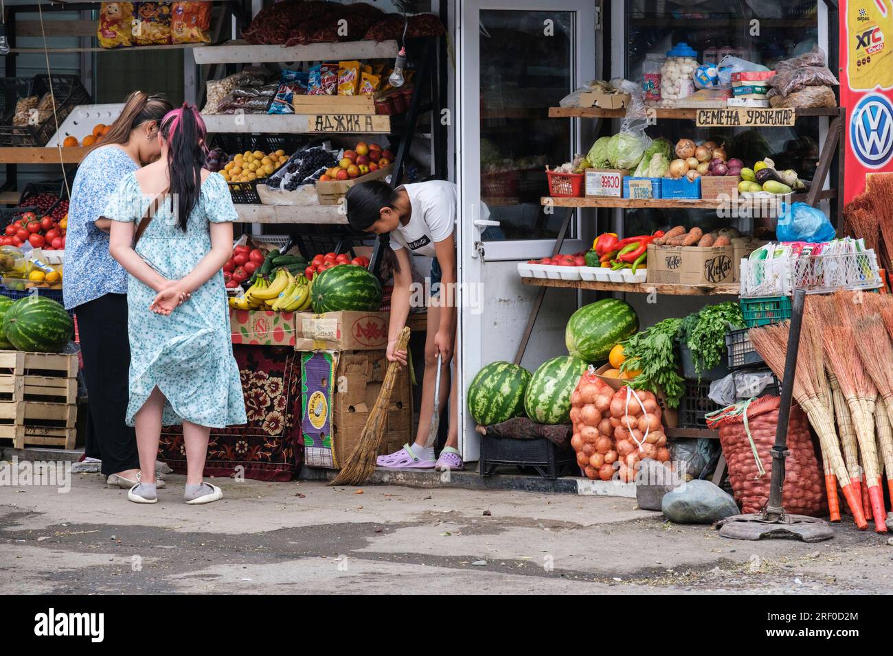 Kazakhstan, Bayseit. Market Street Scene, Women Shopping for Fresh