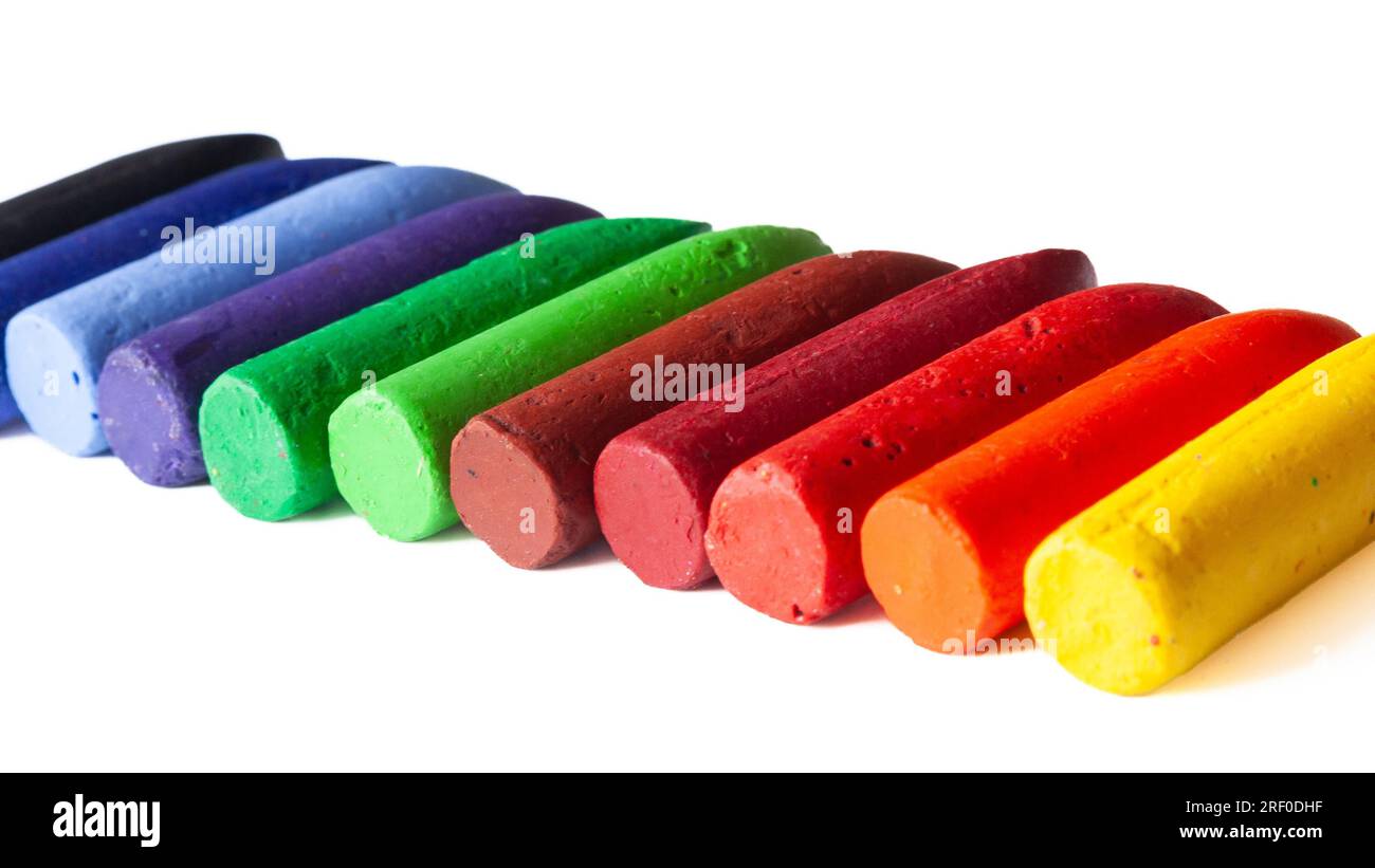 Coloured chunky wax crayons in a row with a white background Stock Photo Alamy
