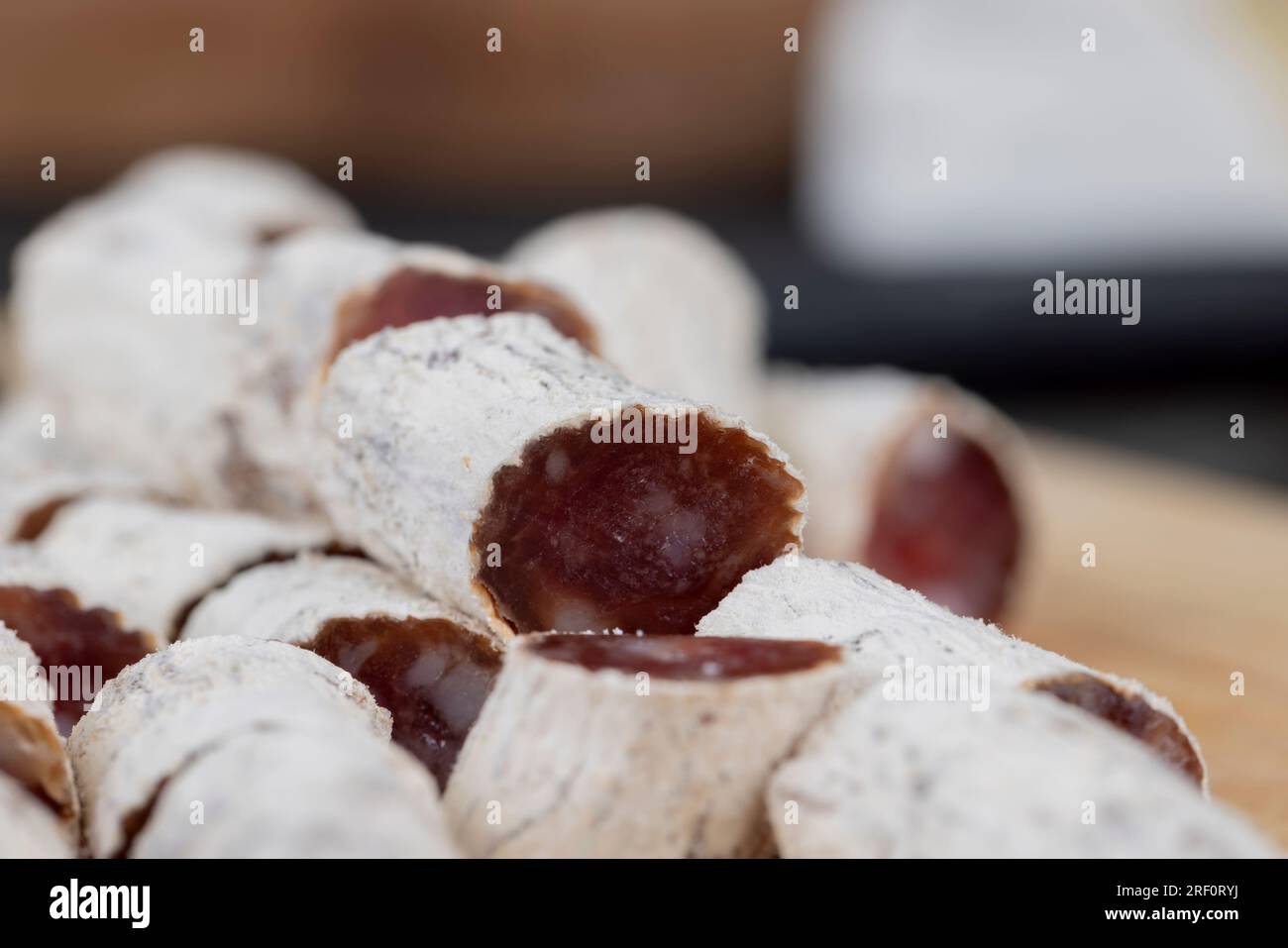 dried sausage with white mold cut into small pieces, thin pork sausage