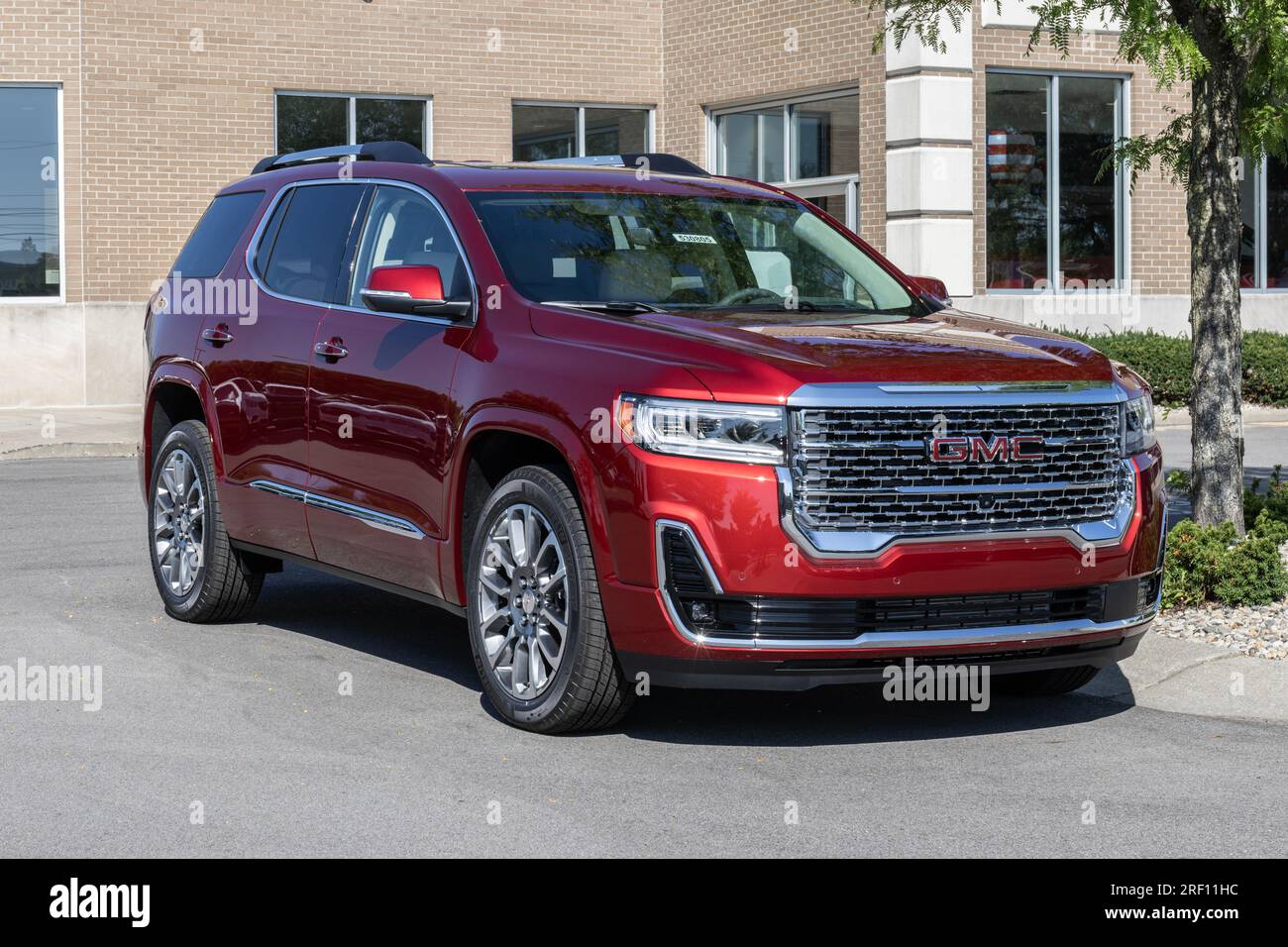 Carmel July 30, 2023 GMC Acadia SUV display at a dealership. GMC offers the Acadia in SLE