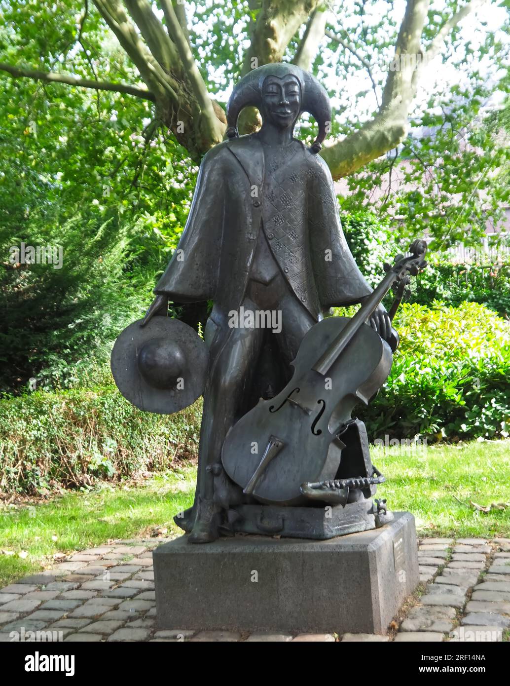 Juggler and muse sculpture in the castle park of Schloss Neersen in Germany by Michael Franke Stock Photo