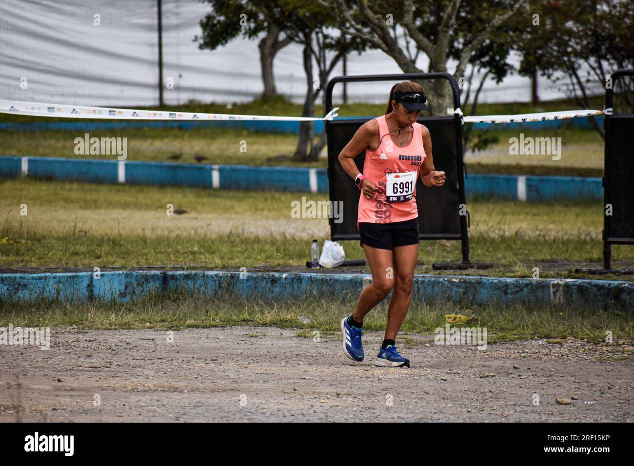 Bogota, Colombia. 30th July, 2023. A runner warms up during Bogota's