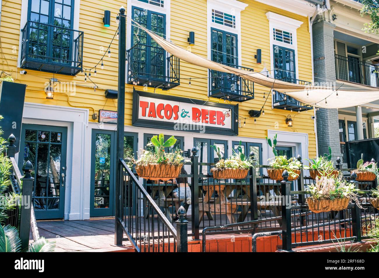 NEW ORLEANS, LA, USA - JULY 30, 2023: Tacos and Beer Restaurant on St. Charles Avenue in the Garden District Stock Photo