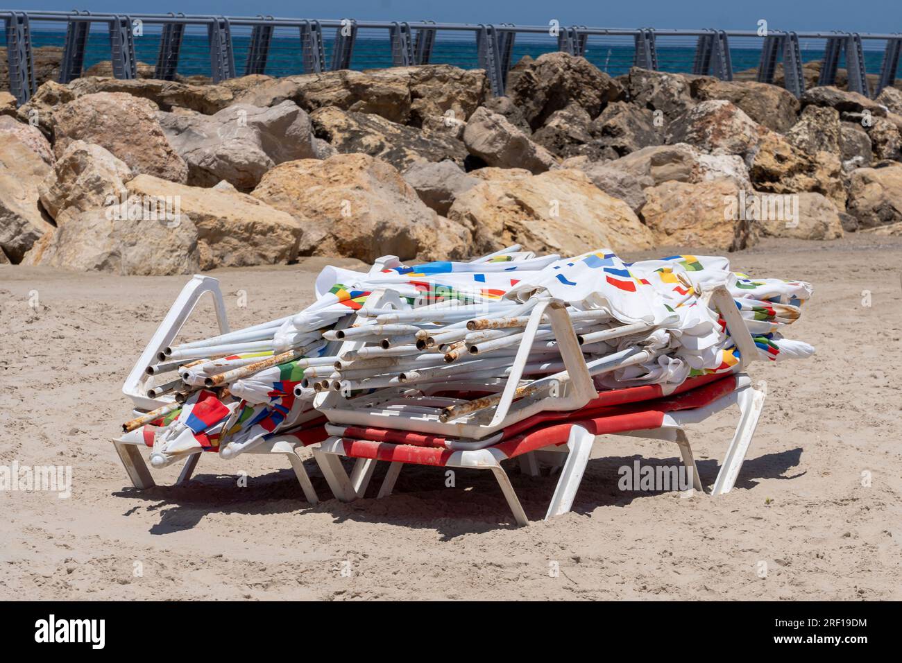 Tel Aviv, Israel, Israel. 30th July, 2023. (NEW) Daily Life In Israel  Summer 2023. July 21, 2023, Tel Aviv, Israel: A pile of unused beach  umbrellas seen at Tel Baruch beach on