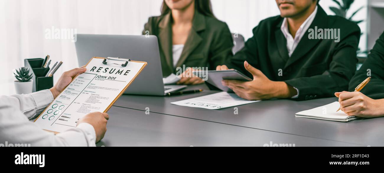 Candidate and interviewers discuss work experience and qualifications