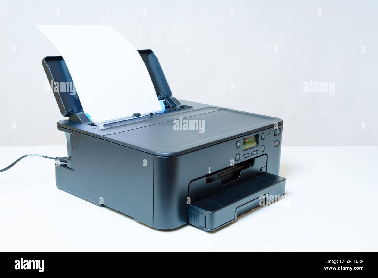 Side view of an inkjet printer having a sheet of paper neatly installed