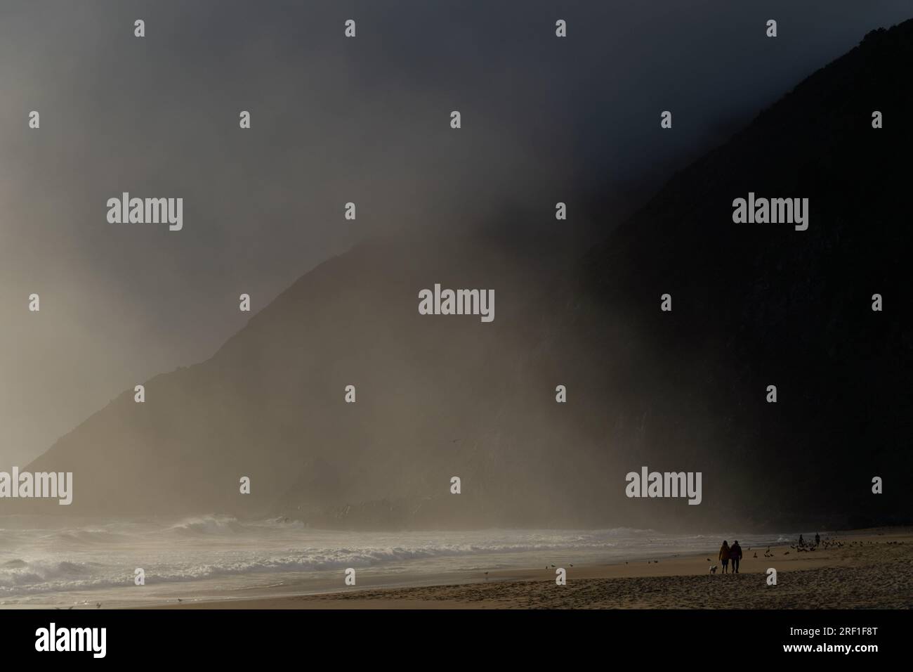 Quintay, Valparaiso, Chile. 29th July, 2023. People walk along the seashore at sunset in Quintay, Chile, on a mild winter day. (Credit Image: © Matias Basualdo/ZUMA Press Wire) EDITORIAL USAGE ONLY! Not for Commercial USAGE! Stock Photo