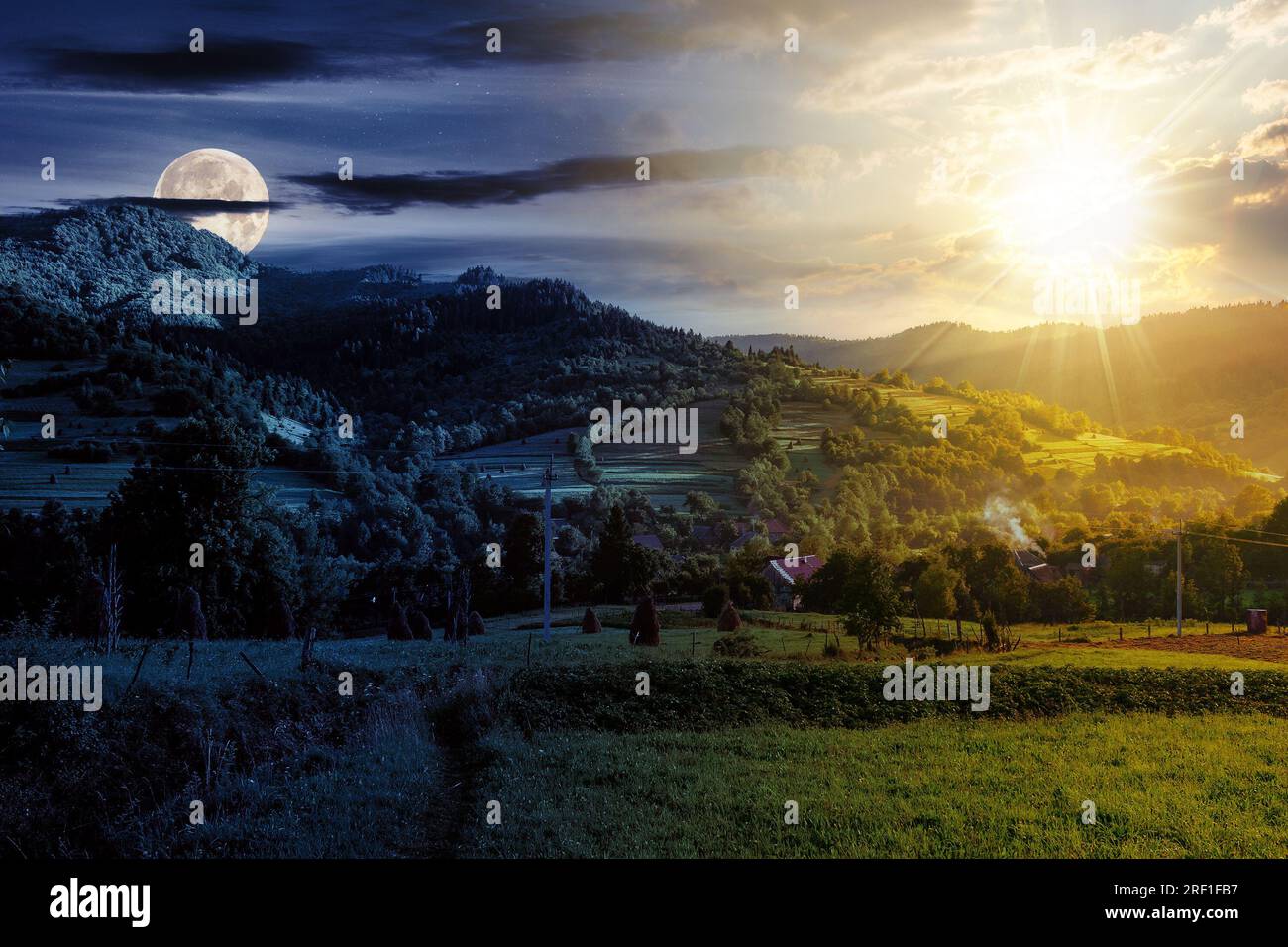 summer rural landscape with sun and moon at twilight. village in the valley, haystacks near forest. day and night time change concept. mysterious coun Stock Photo