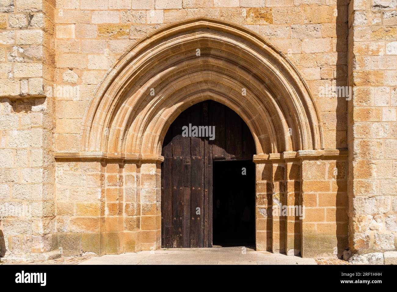 Door with pointed arch in the church of San Isidoro in Zamora, Spain Stock Photo