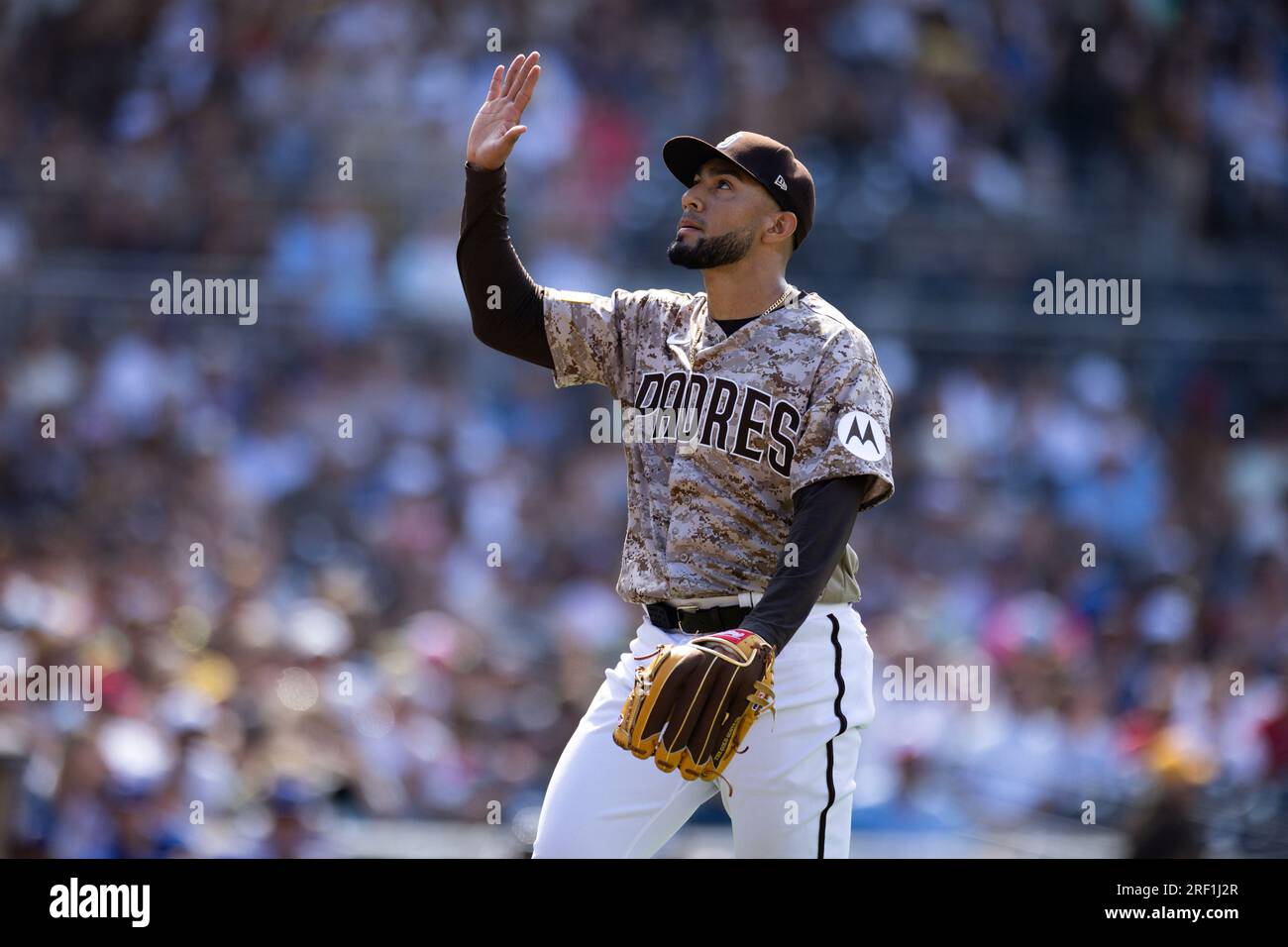San Diego Padres' Robert Suarez gestures to the sky as he walks to the  dugout in the eighth inning of a baseball game against the Texas Rangers  Sunday, July 30, 2023, in