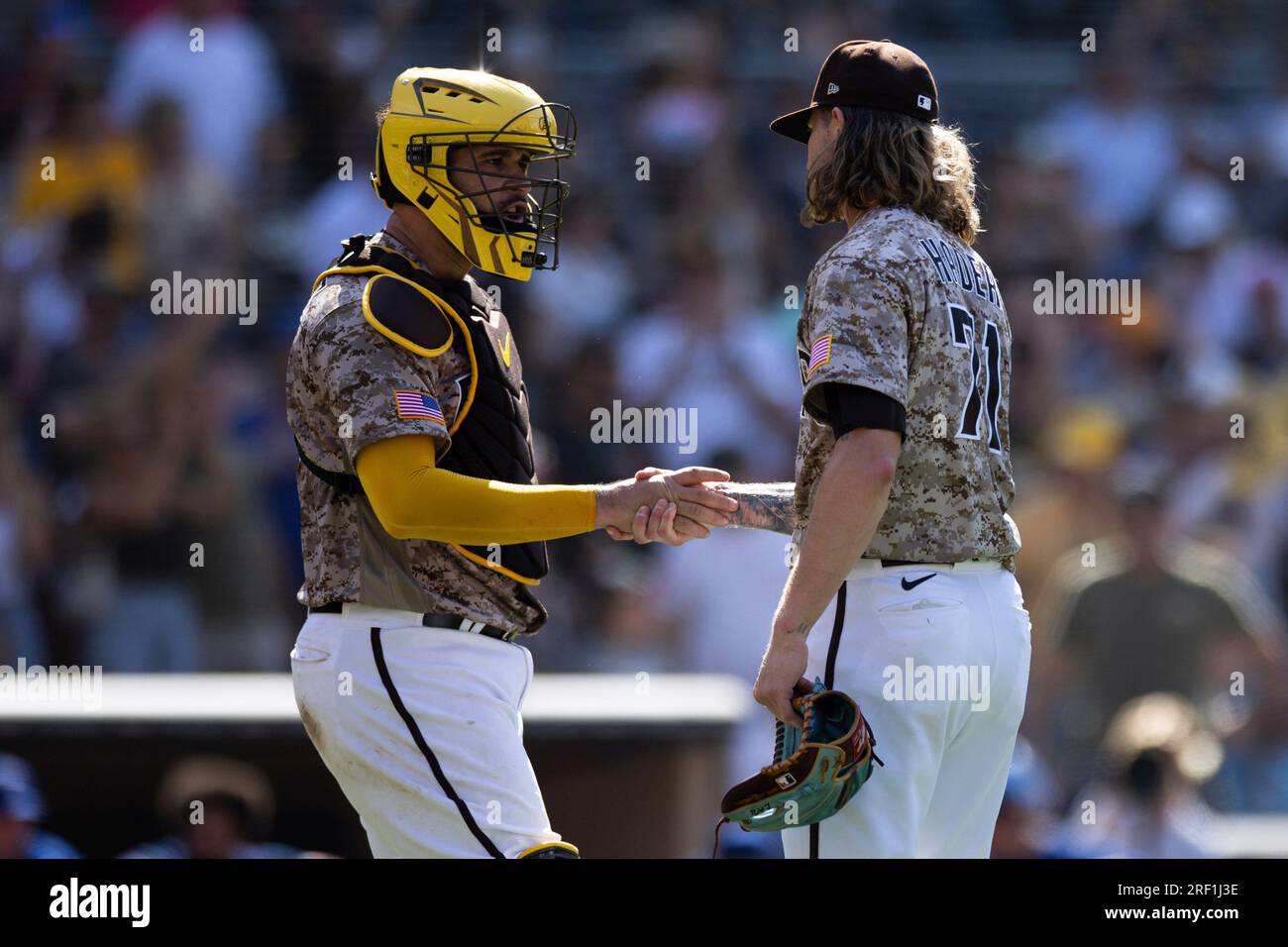 San Diego Padres' Josh Hader, foreground, embraces with catcher Gary Sanchez  after the team defeated the Cleveland Guardians in a baseball game Tuesday,  June 13, 2023, in San Diego. (AP Photo/Derrick Tuskan