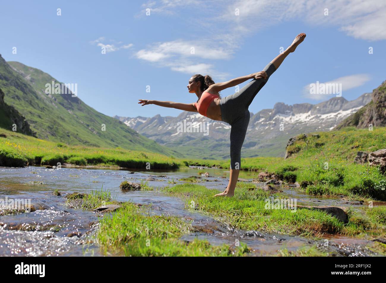 Dancer woman danding in a riverside in the mountain Stock Photo - Alamy