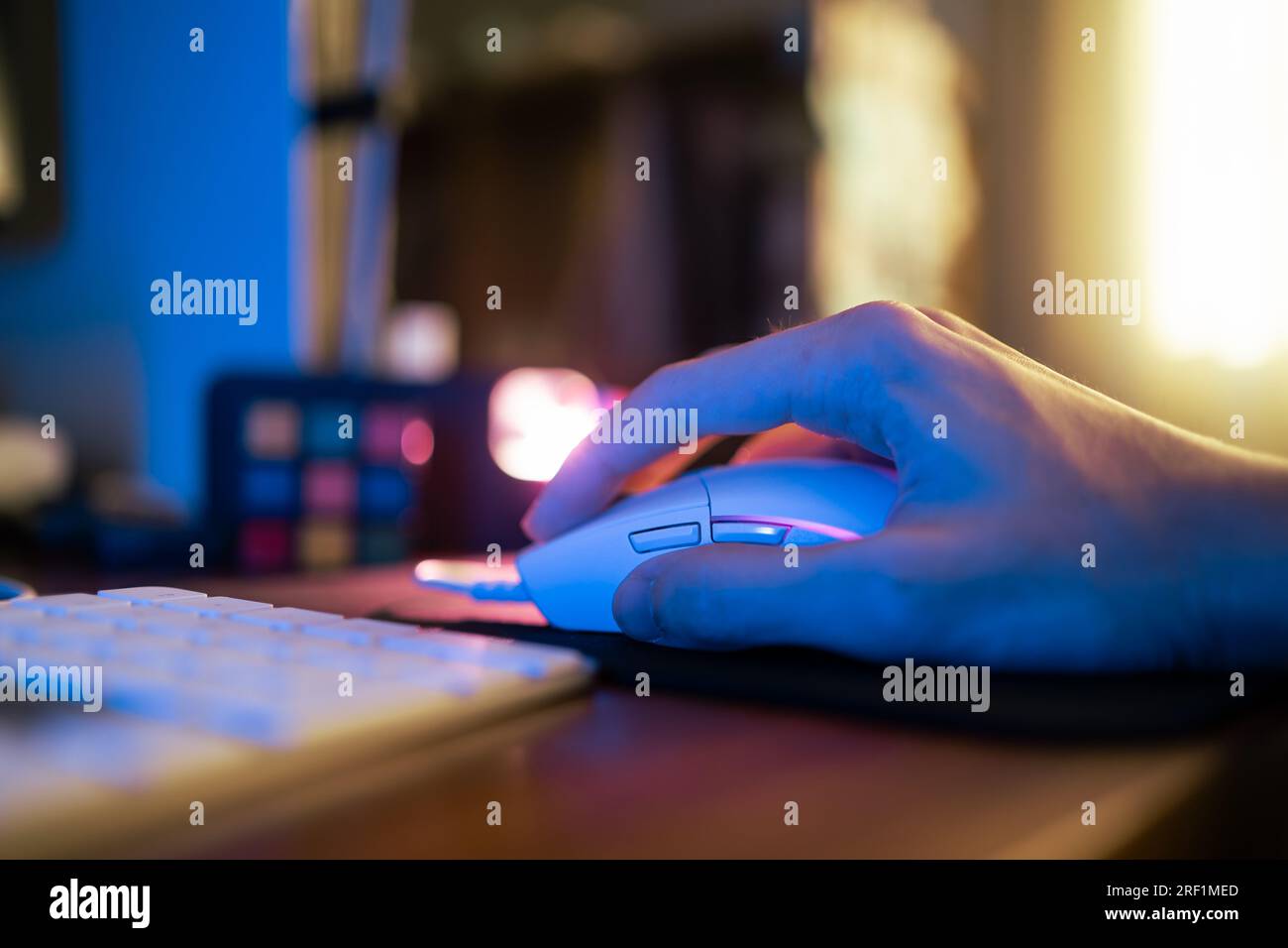 Playing computer game with gaming mouse Stock Photo - Alamy