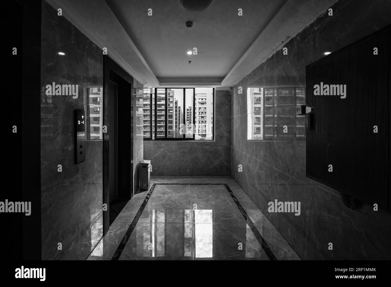 The sunny day interior of the apartment building hallway. Stock Photo
