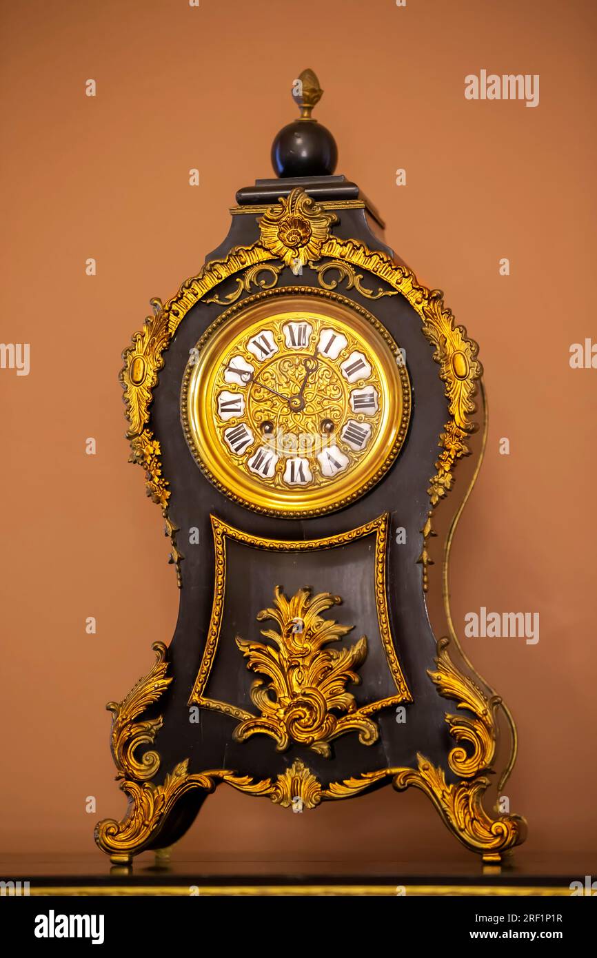 Old gilded wall clock hi-res stock photography and images - Alamy