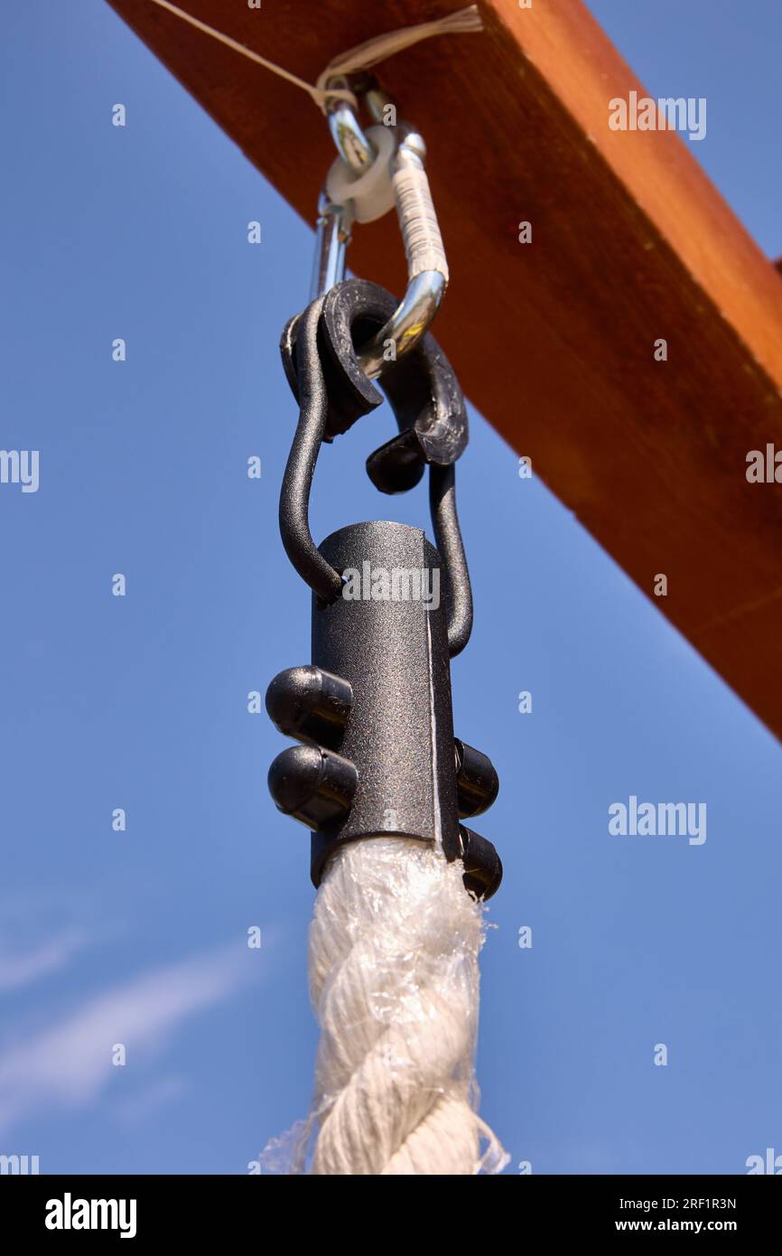 Clamp on climbing rope hanging from outdoor playground Stock Photo Alamy