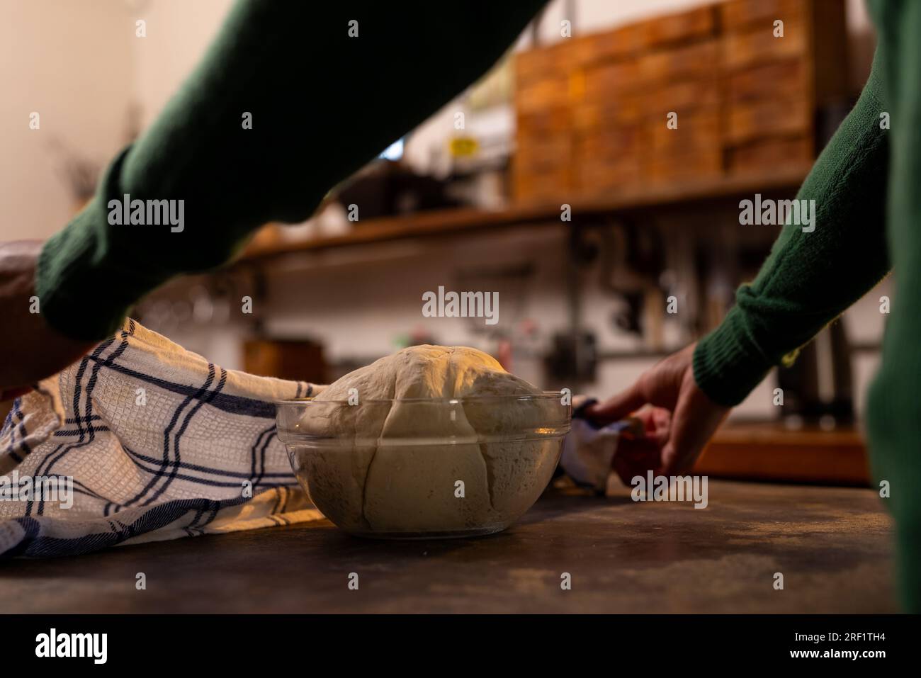 Hands of indian man preparing bread dough in kitchen Stock Photo