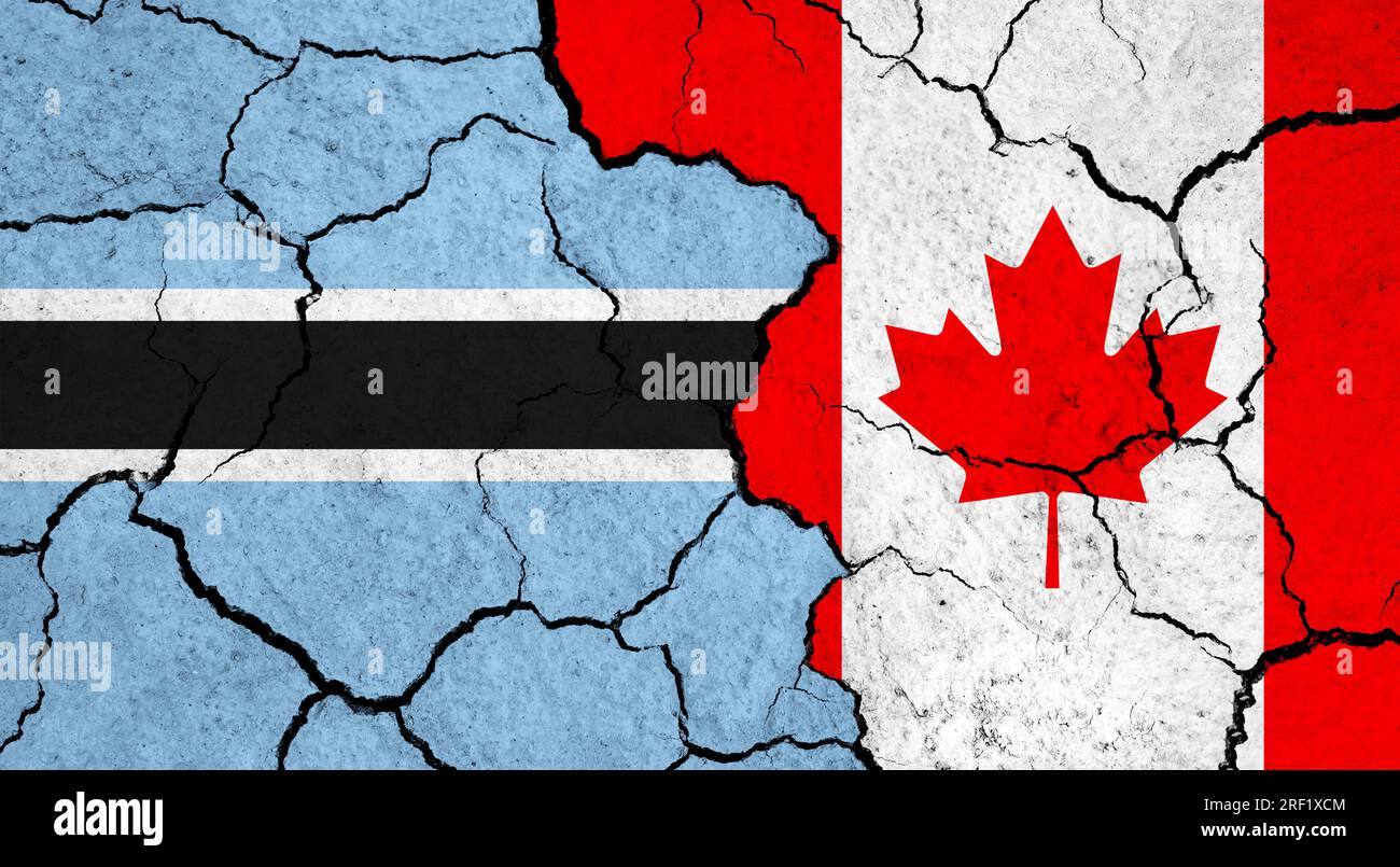 Flags of Botswana and Canada on cracked surface - politics, relationship concept Stock Photo