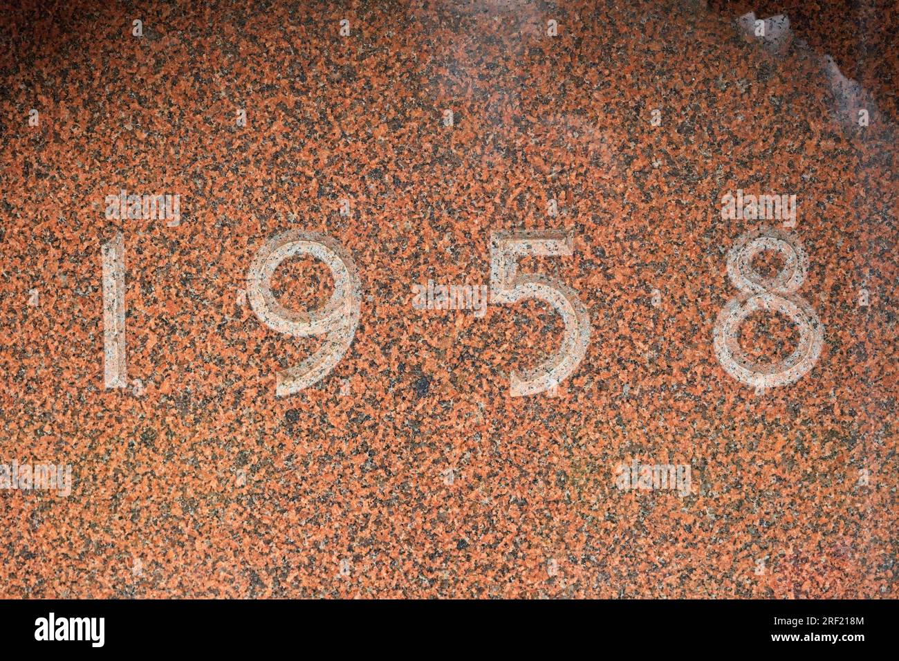 The year 1958 engraved on a gravestone Stock Photo Alamy