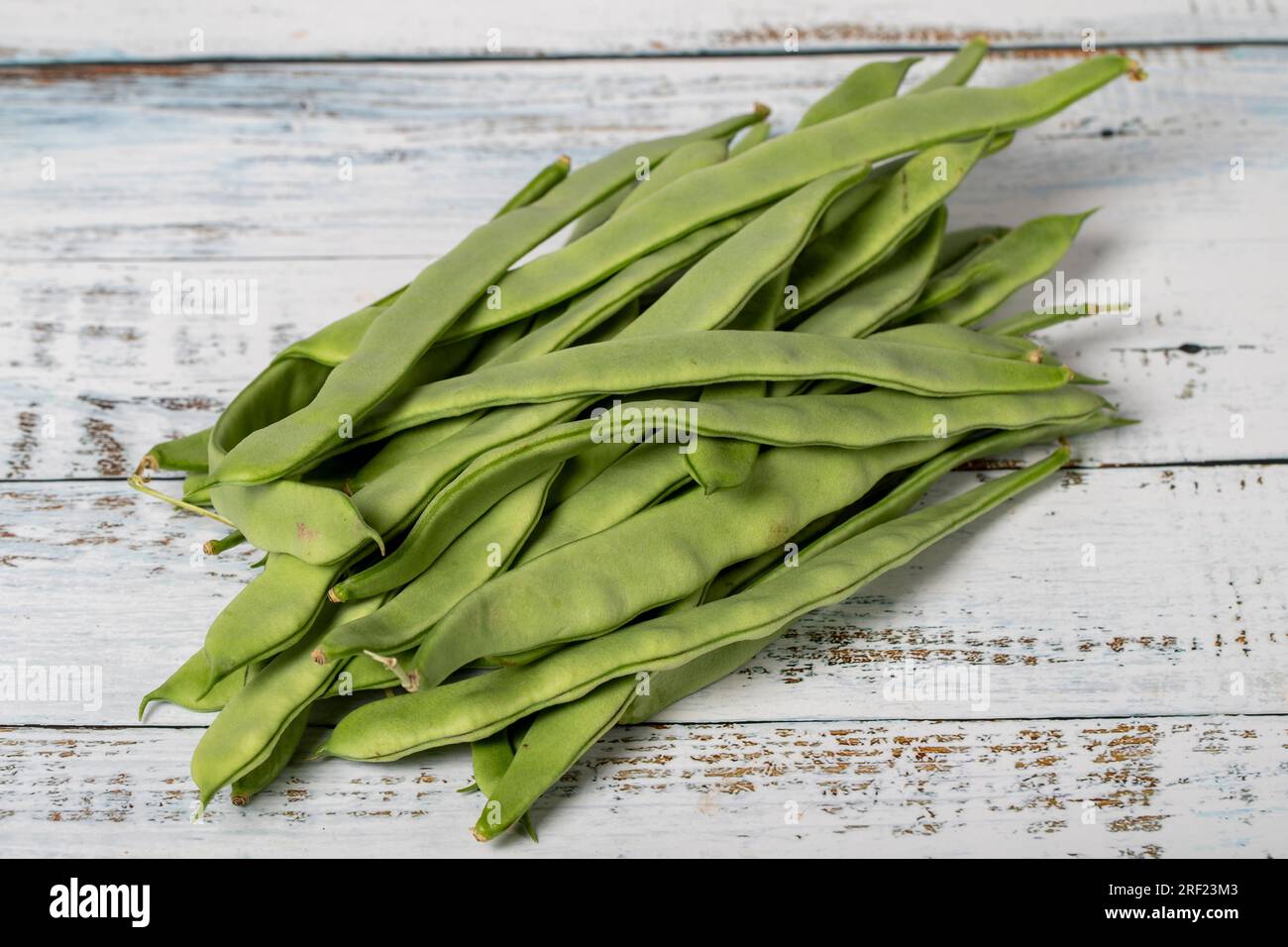 Green beans on a white wood background fresh raw string beans harvest