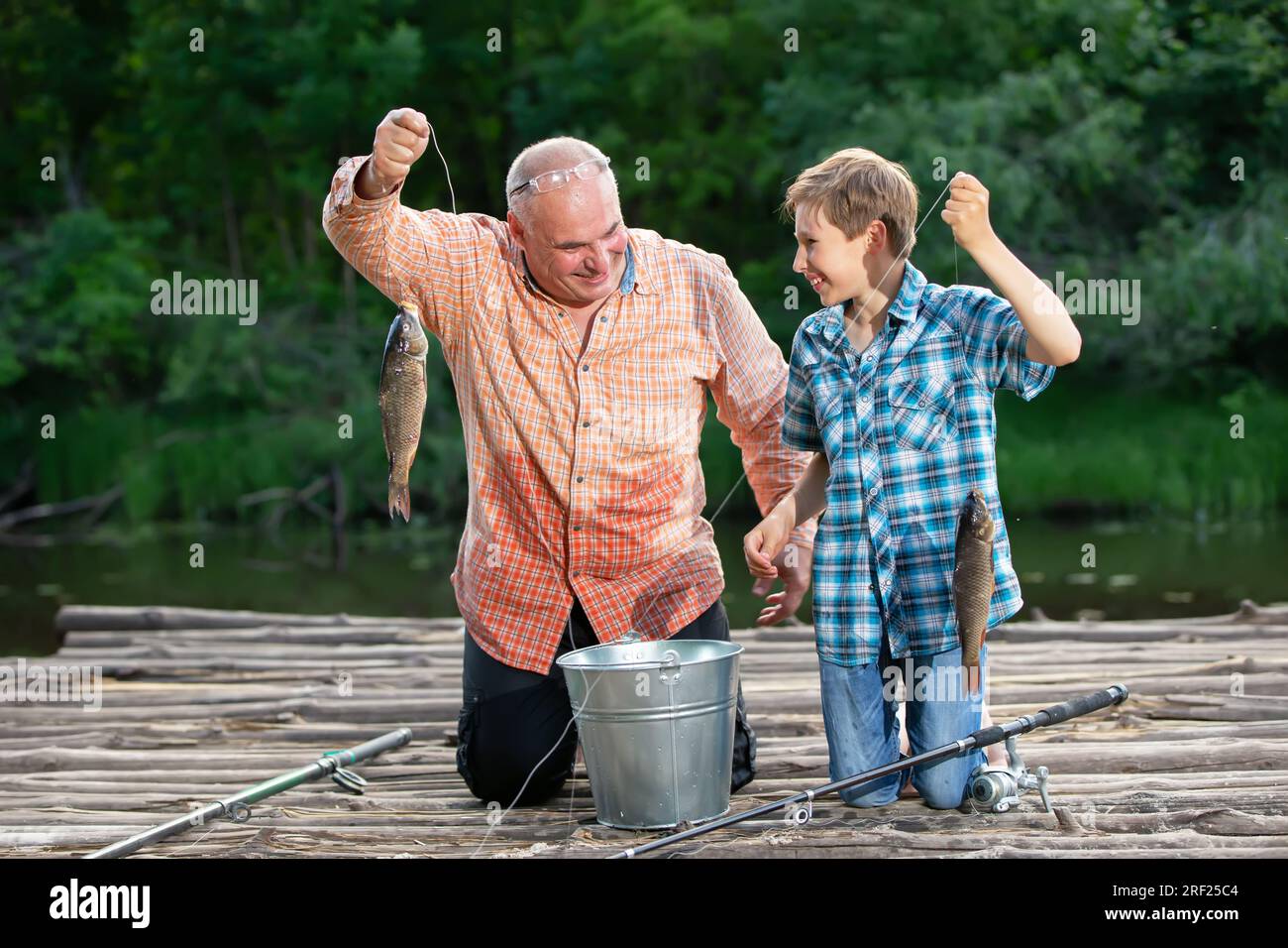 Grandpa grandson fishing hi-res stock photography and images - Alamy