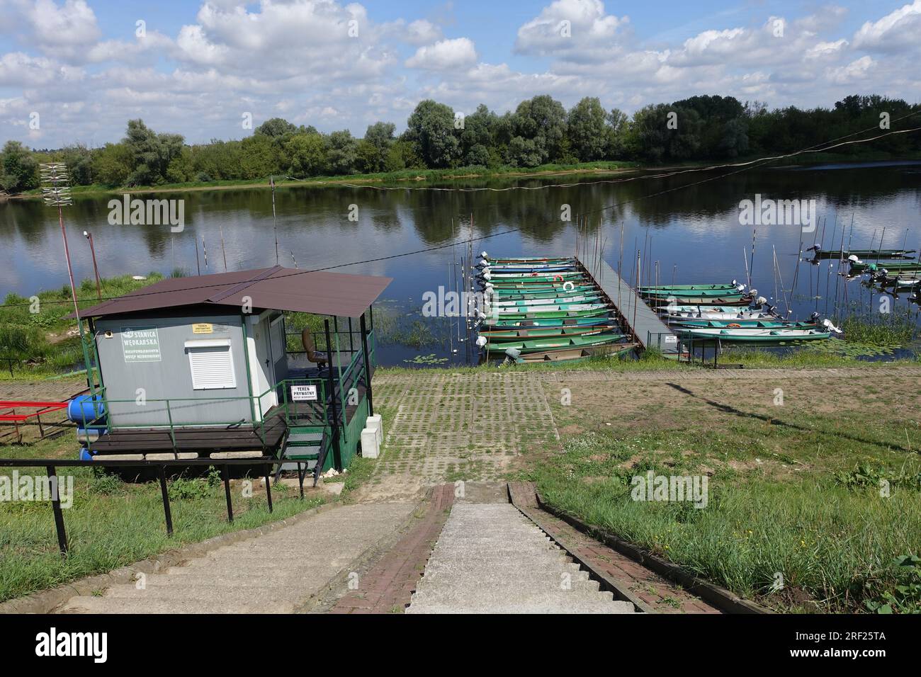 Fishing boats in the small river port of Nowy Dwor Mazowiecki, Poland, on the Narew River Stock Photo