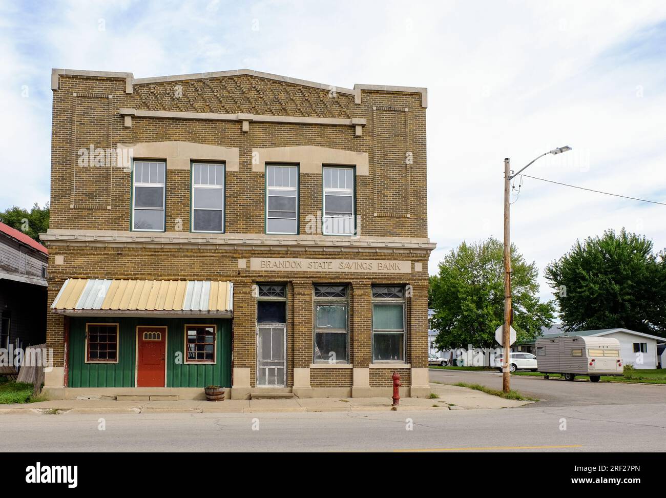 An old building of a former state bank with a sign Brandon State Service Bank in Brandon, Iowa, United States. Stock Photo