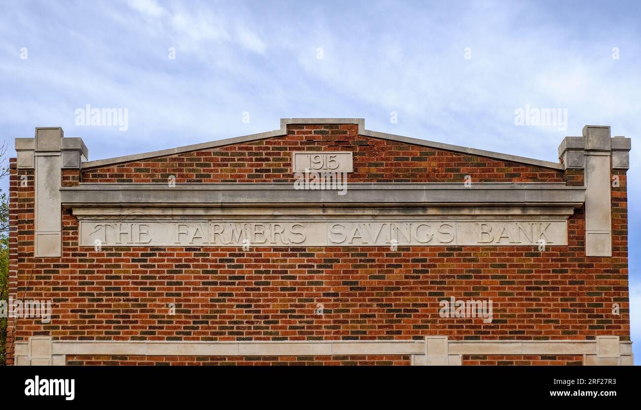 A detail of an old building of a former state bank with a sign The Farmers Savings Bank in Brandon, Iowa, United States. Stock Photo