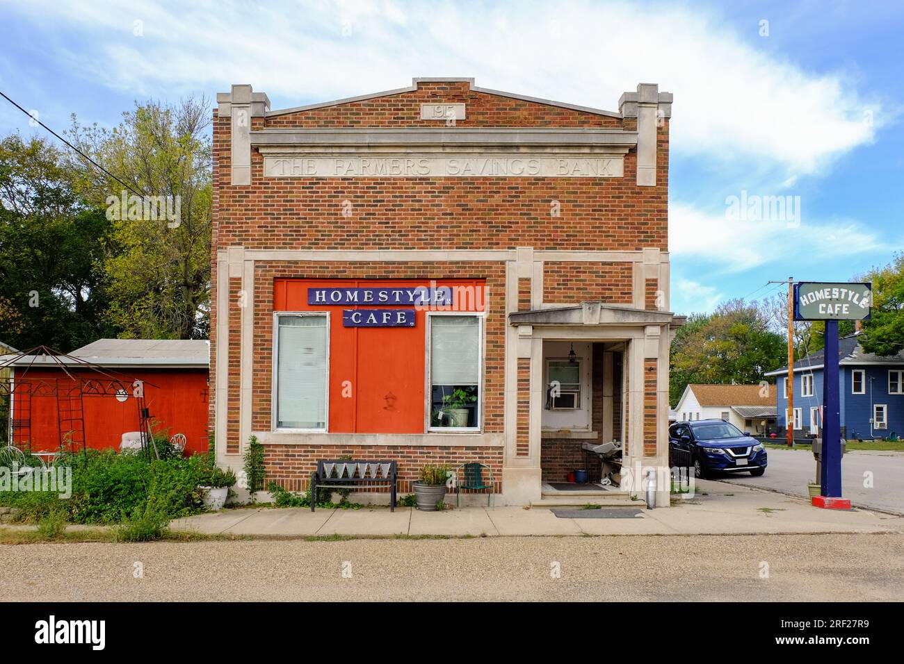 An old building of a former state bank with a sign The Farmers Savings Bank in Brandon, Iowa, United States. Stock Photo