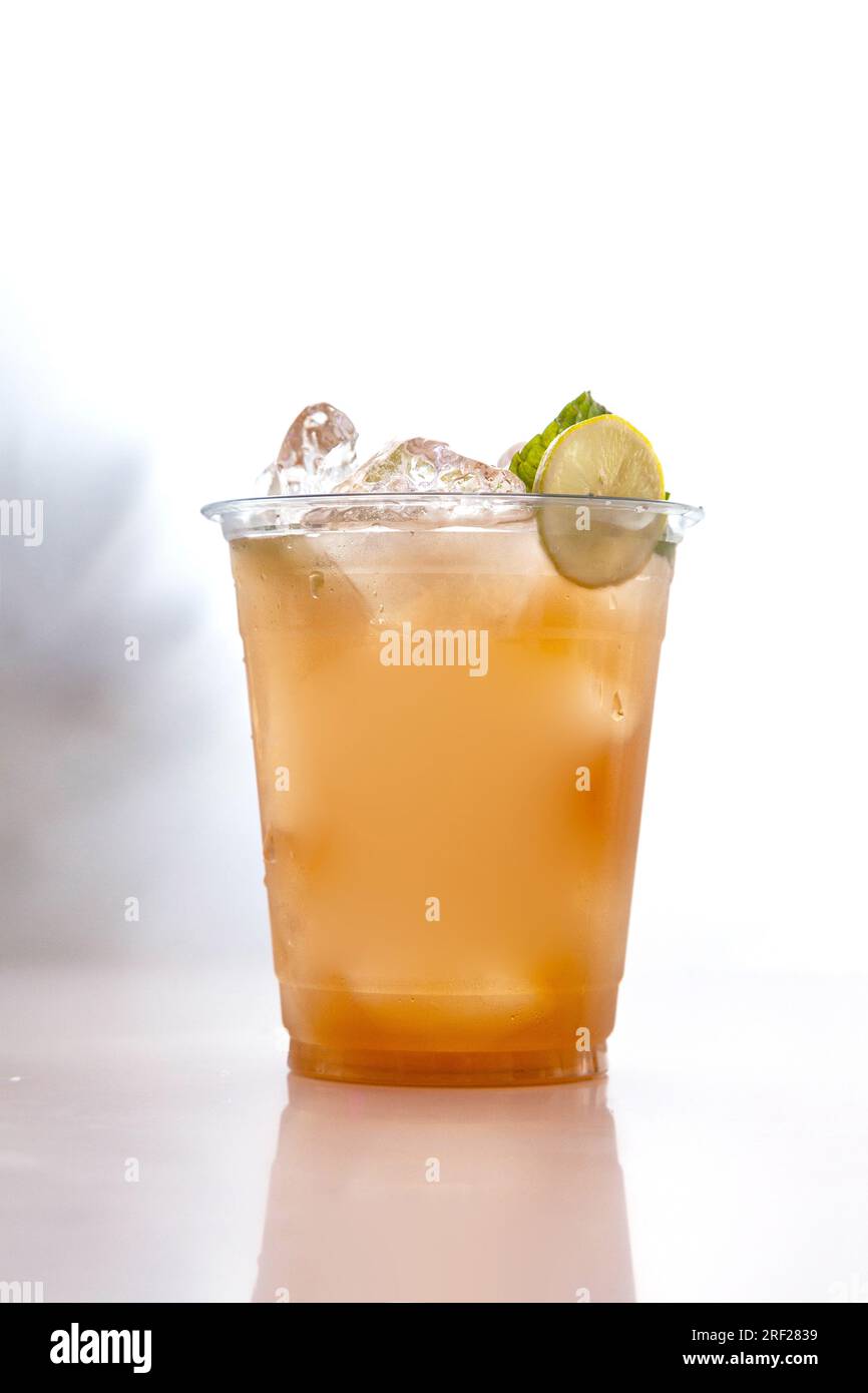 Iced peach cooler drink in plastic cup chilled Stock Photo Alamy