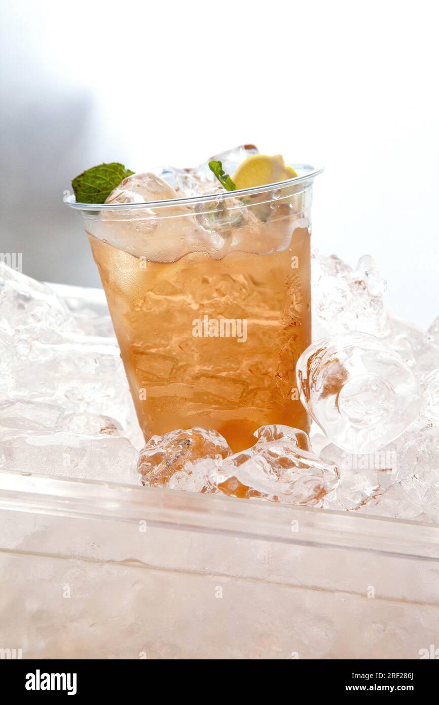 Iced peach cooler drink in plastic cup chilled Stock Photo Alamy