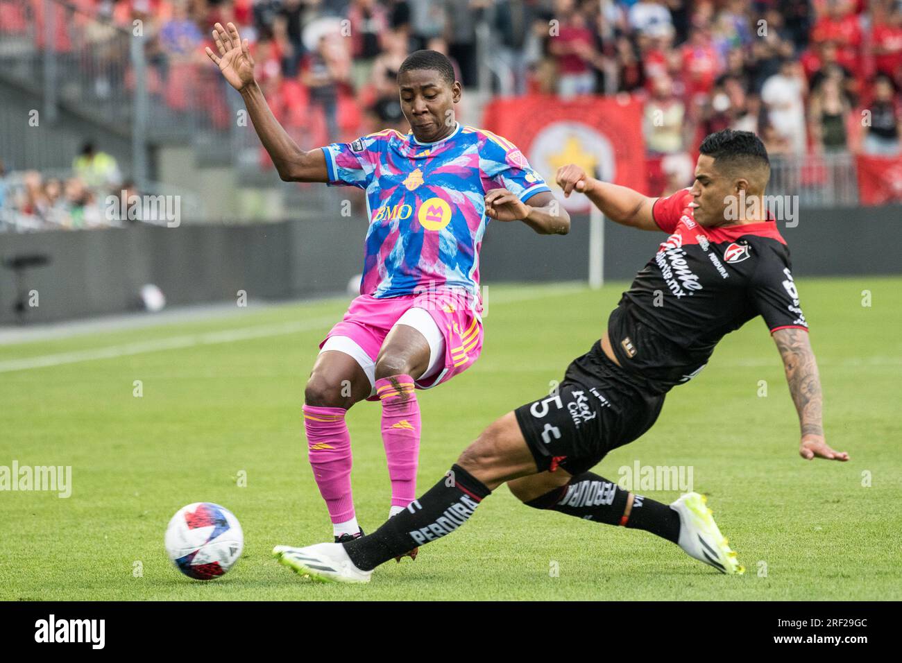 Toronto, Canada. 30th July, 2023. Jes?s Batiz #73 (L) and Anderson SantamarÌa #5 (R) in action during the Leagues Cup game between Toronto FC and Atlas FC at BMO field in Toronto. The game ended 0-1 Credit: SOPA Images Limited/Alamy Live News Stock Photo