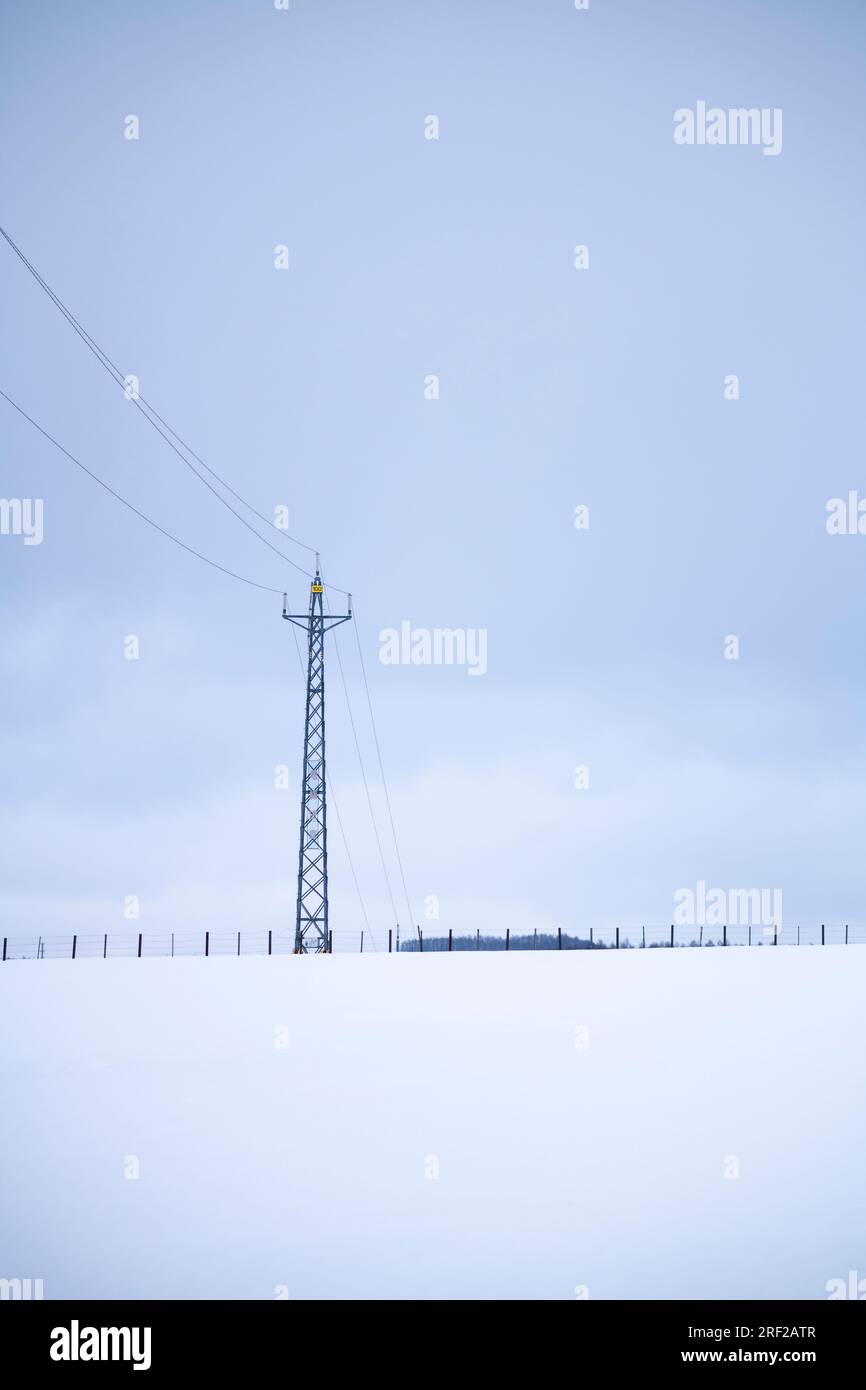 Transmission tower in the snow, Biei, Hokkaido, Japan Stock Photo