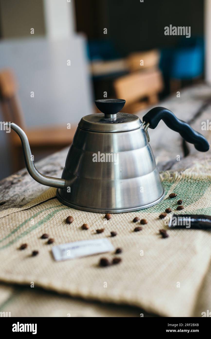 Caffeine Design Concept - Old Kettle For Coffee, Coffee Cups On A Wooden  Background. Stock Photo, Picture and Royalty Free Image. Image 94777075.