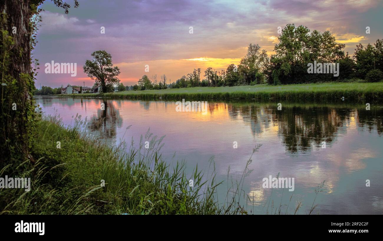 Cloudy sky before storm on river ,Italy Stock Photo