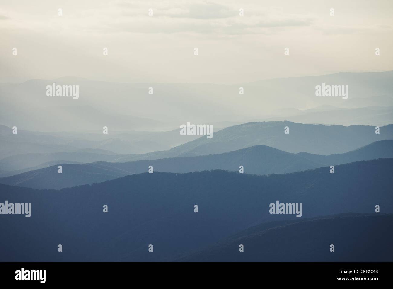 Mountain range with visible silhouettes through the morning colorful ...