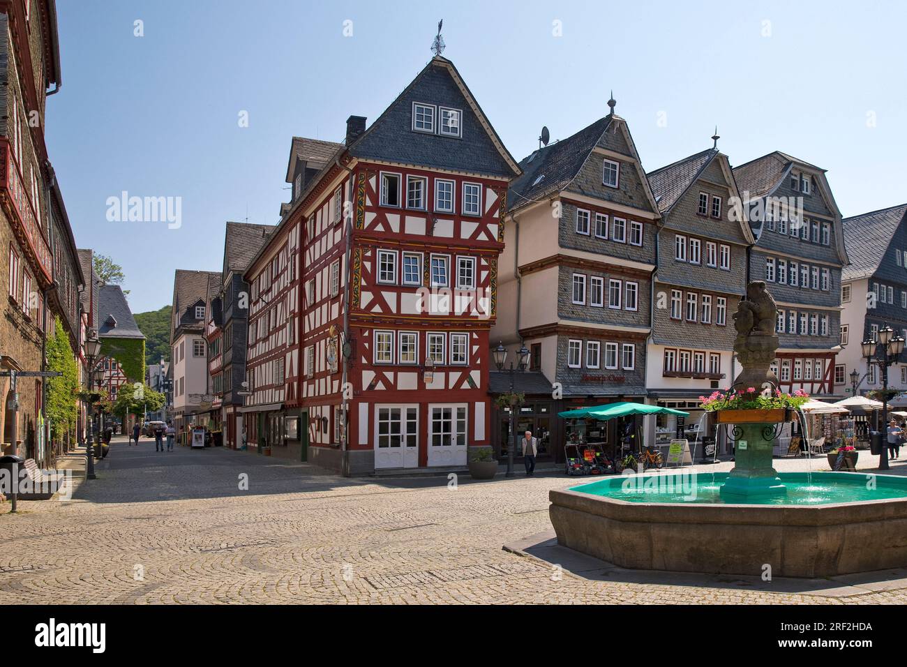 half-timbered houses at the Buttermarkt with market fountain in the historic Old Town, Germany, Hesse, Herborn Stock Photo
