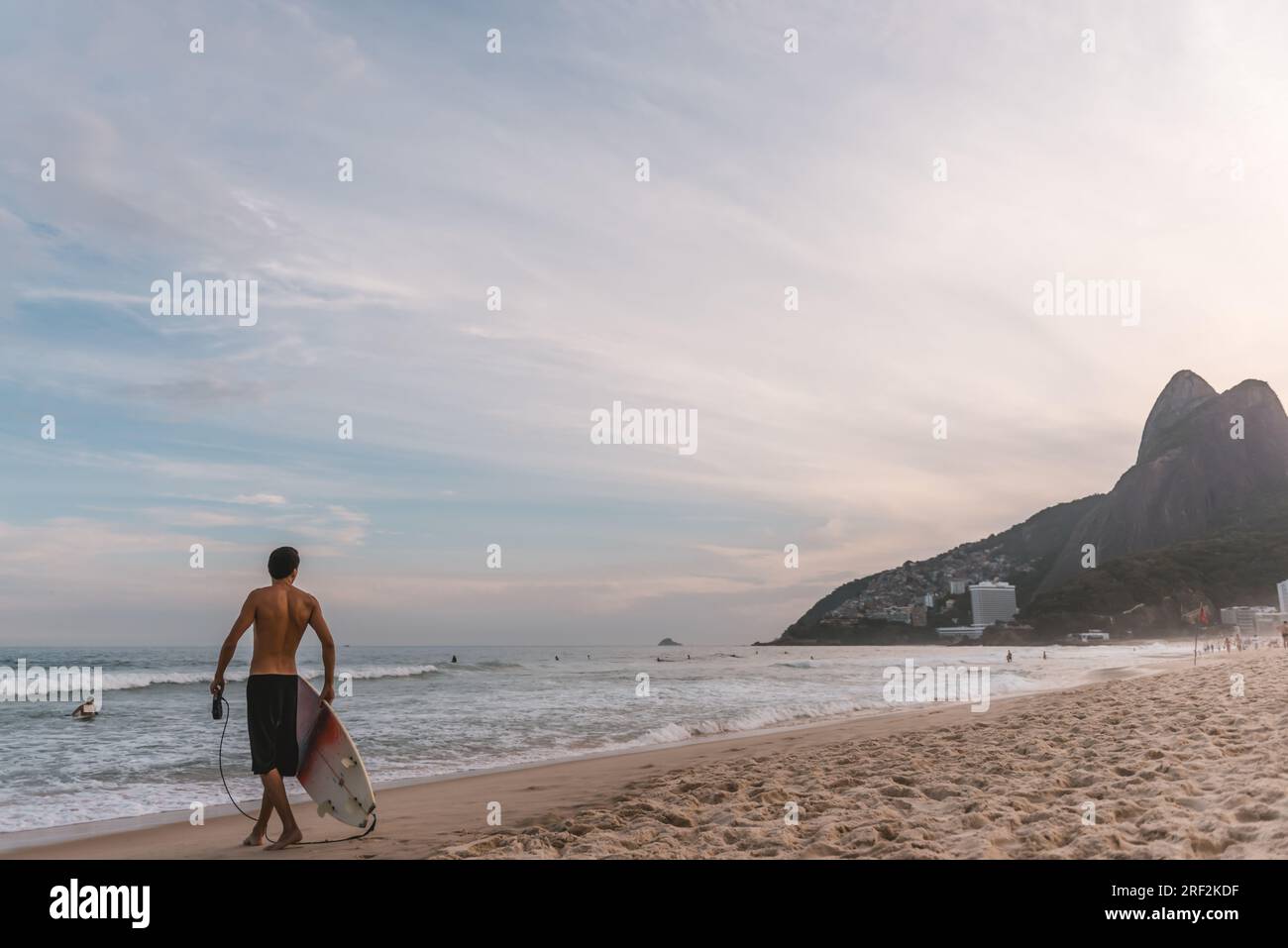 Young man waiting for the perfect wave in Rio de Janeiro Stock Photo ...