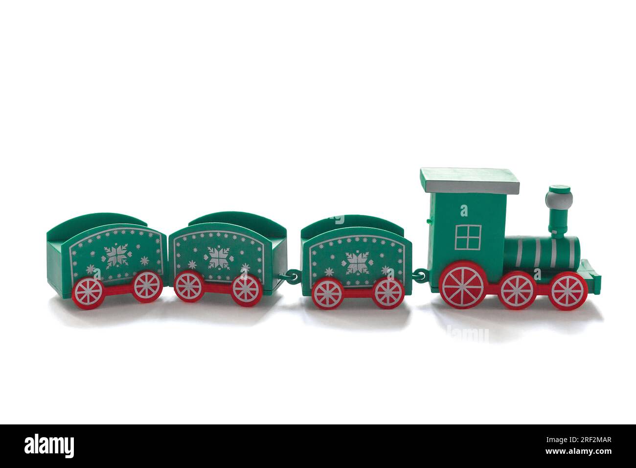blue christmas train with red wheels on a white background. front view toy Stock Photo