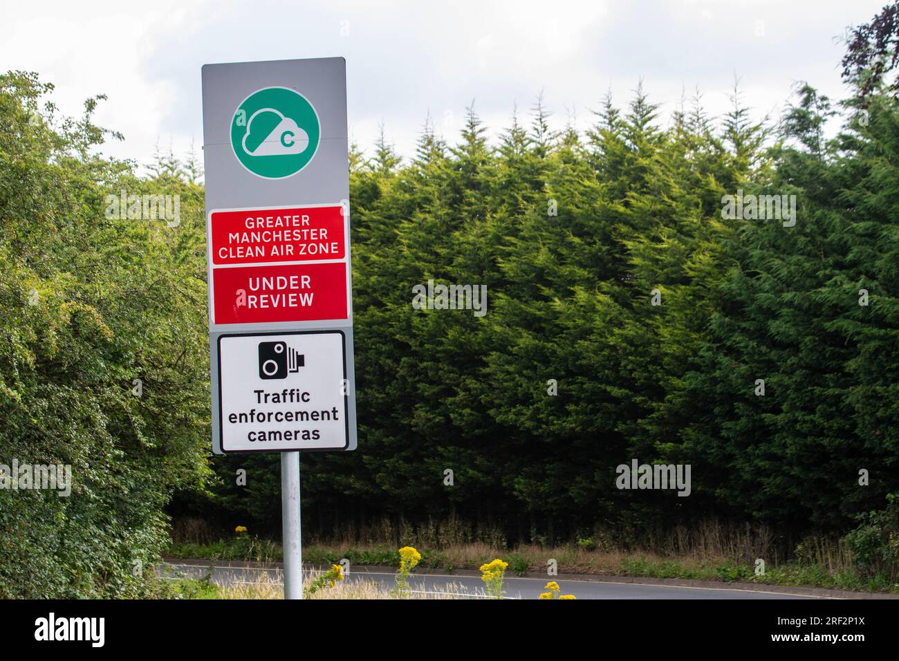 Greater Manchester Clean Air Zone traffic sign. Under review Traffic Enforcement cameras sign Stock Photo