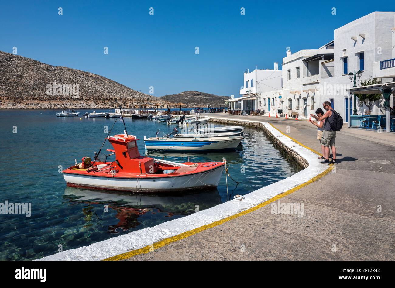 Tourists at the Quayside, Panormos, Tinos Stock Photo - Alamy