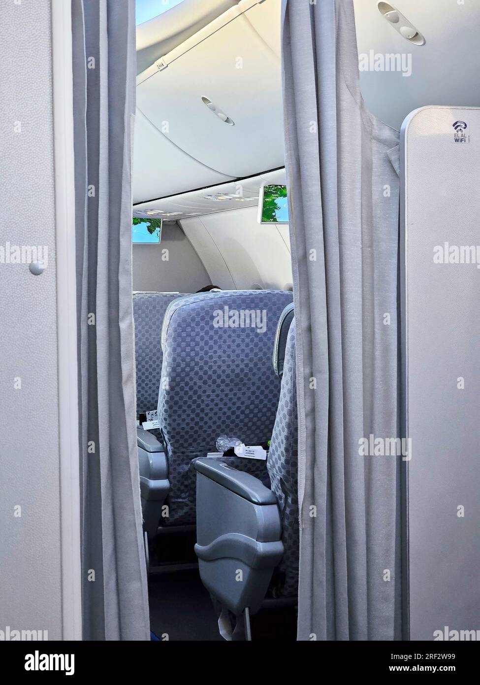 Entrance to the business class on board Boeing 737 Stock Photo