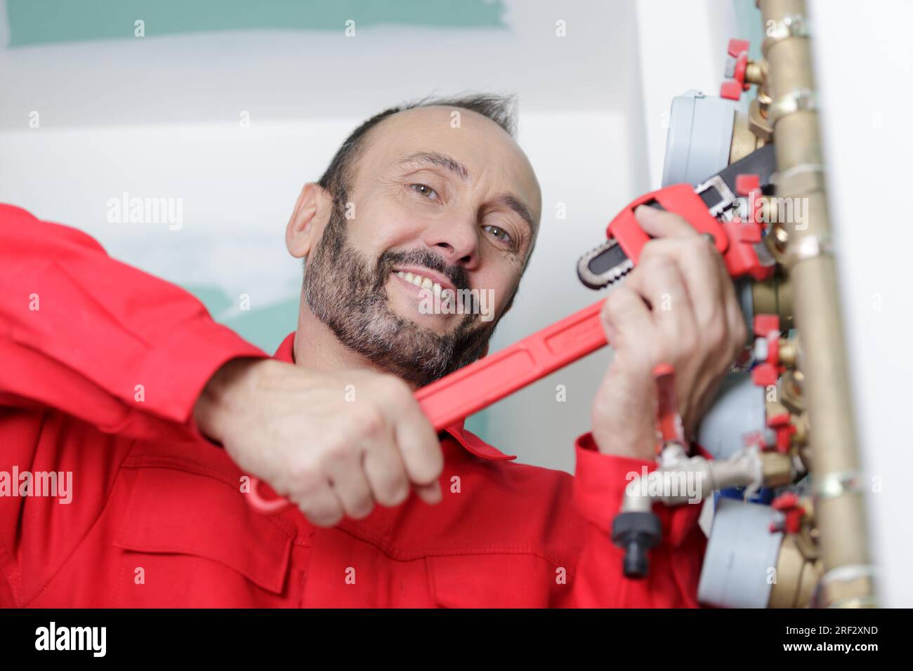 Person Using Wrench Person using wrench tighten brass hi-res stock photography and images ...