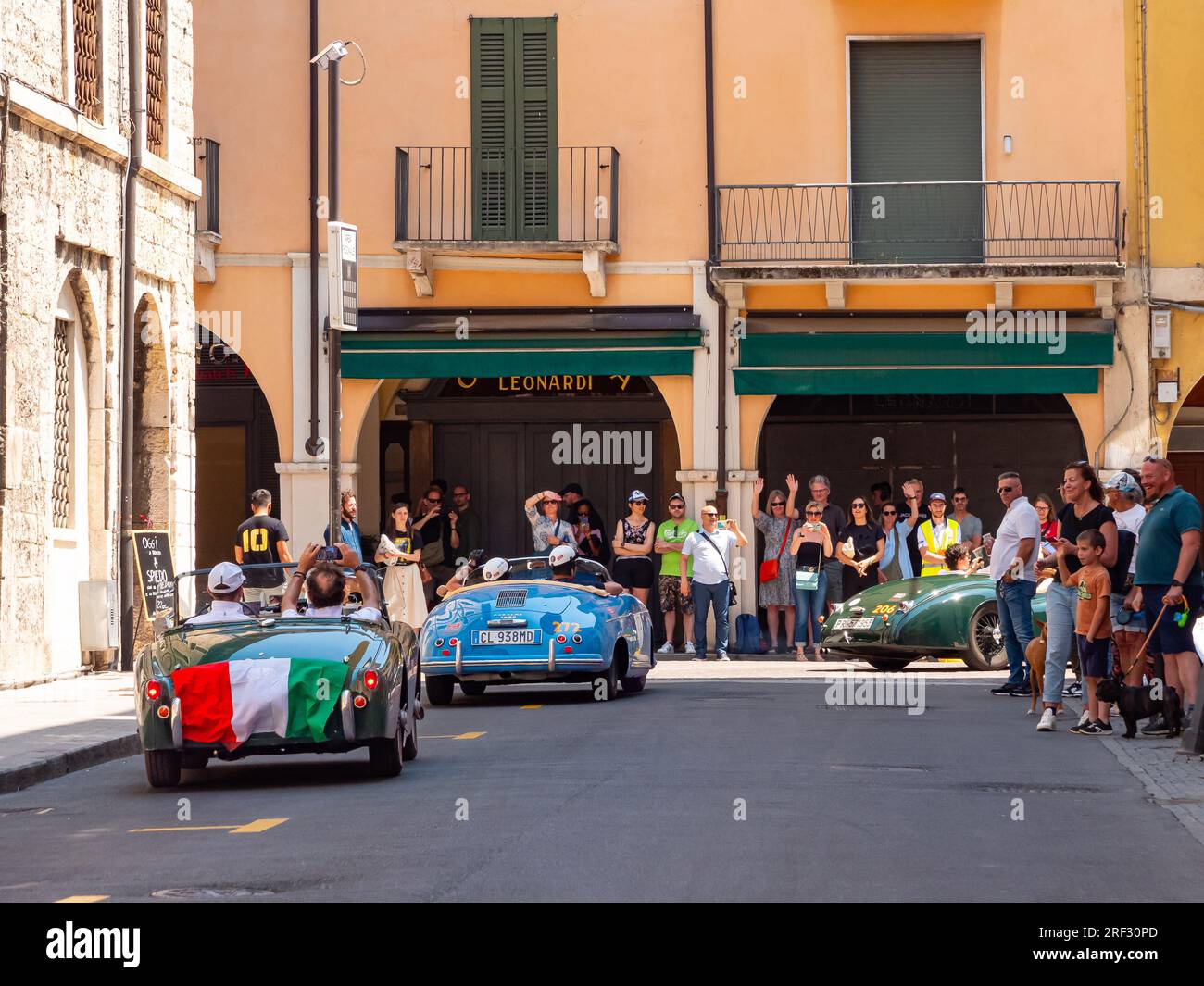 Three classic cars driving through the streets of Brescia, Mille Miglia 2023, day5 Stock Photo