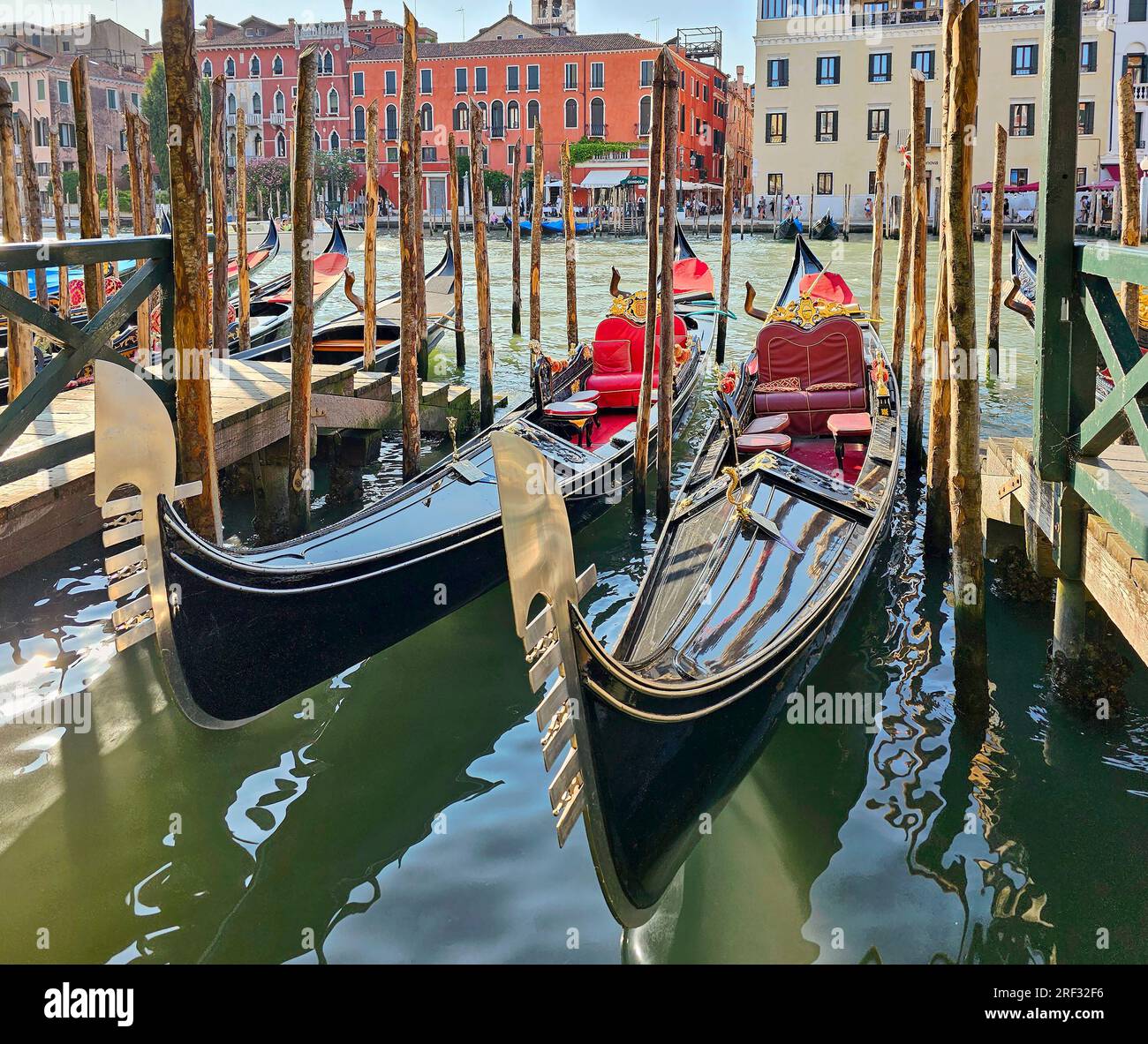 Gondolas on the quay in Venetian lagoon Stock Photo - Alamy