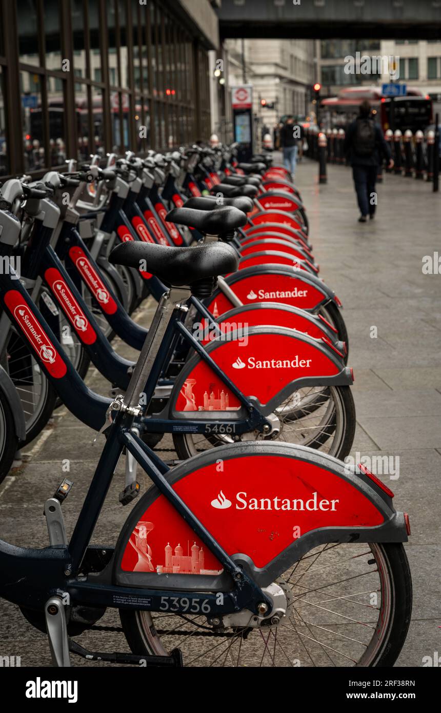 London, UK: Cycle hire station on Queen Victoria Street near Blackfriars station in the City of London. These bicycles are sponsored by Santander. Stock Photo