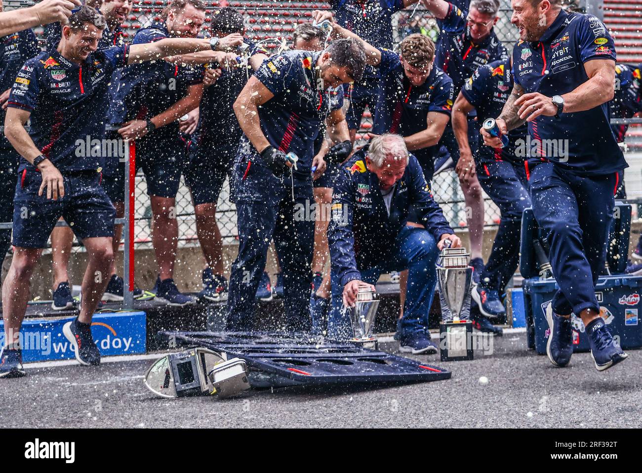 Spa, Belgium. 30th July, 2023. Helmut Marko of Red Bull Racing tries to save the trophies after one of them broke while celebrating winning the F1 Grand Prix of Belgium at Circuit de Spa-Francorchamps on July 30, 2023 in Spa, Belgium. (Credit Image: © Beata Zawrzel/ZUMA Press Wire) EDITORIAL USAGE ONLY! Not for Commercial USAGE! Stock Photo